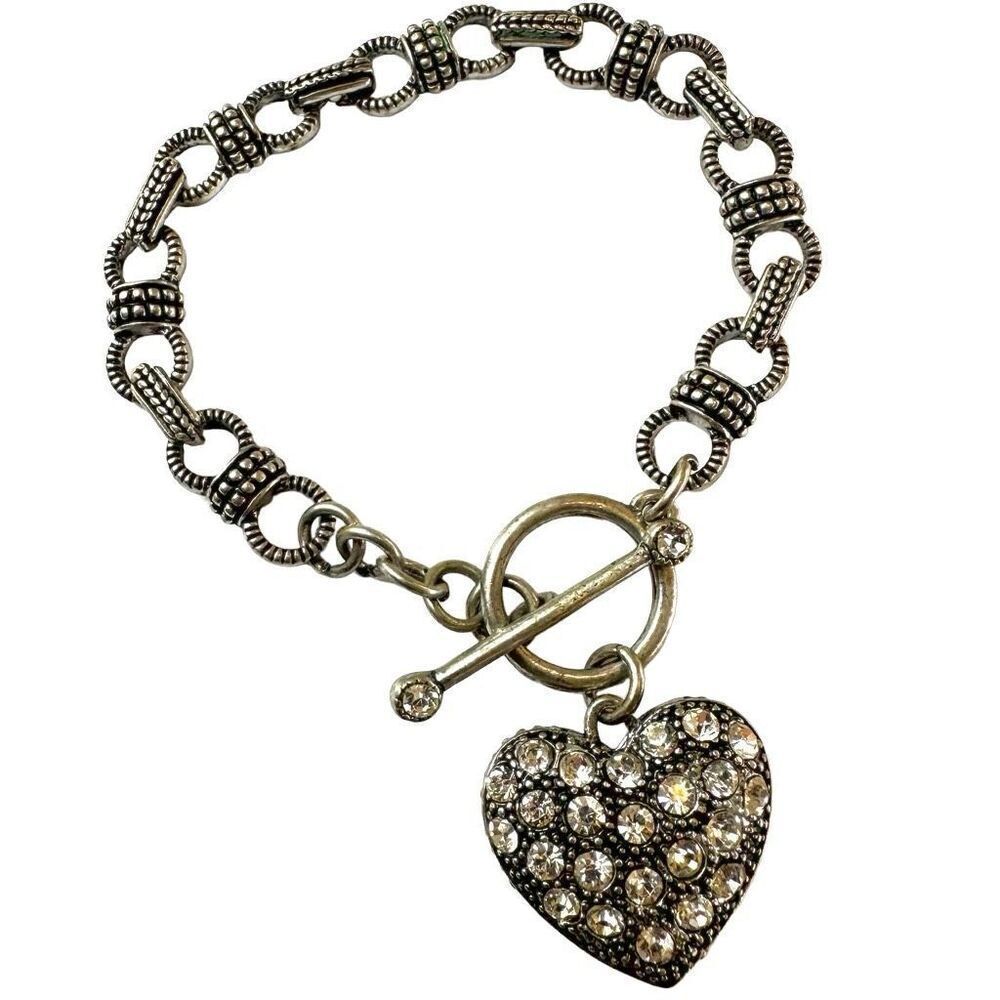 Silver tone bracelet with rhinestone heart charm